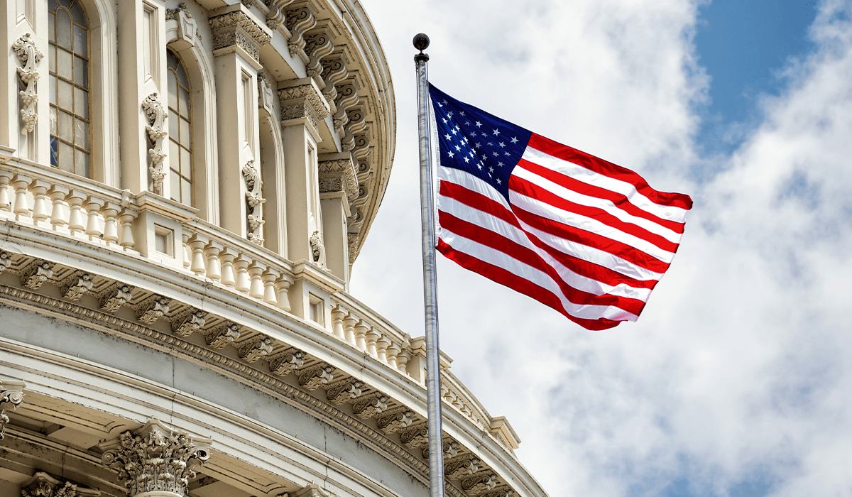 American flag in front of Capitol